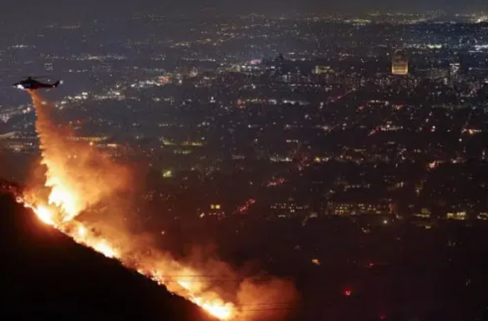 On Wednesday, a wildfire spread through Hollywood Hills, and helicopters were used to drop water in an effort to control the flames.