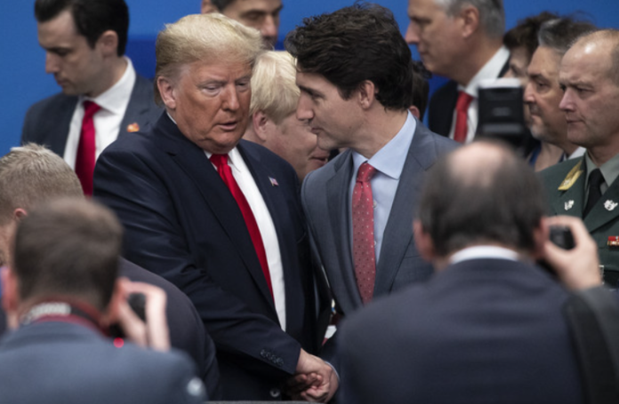 President Donald Trump and Canadian Prime Minister Justin Trudeau attend the NATO summit at the Grove Hotel on December 4, 2019, in Watford, England