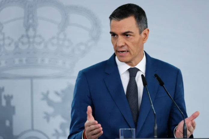 Spain's Prime Minister Pedro Sanchez gestures during a press conference